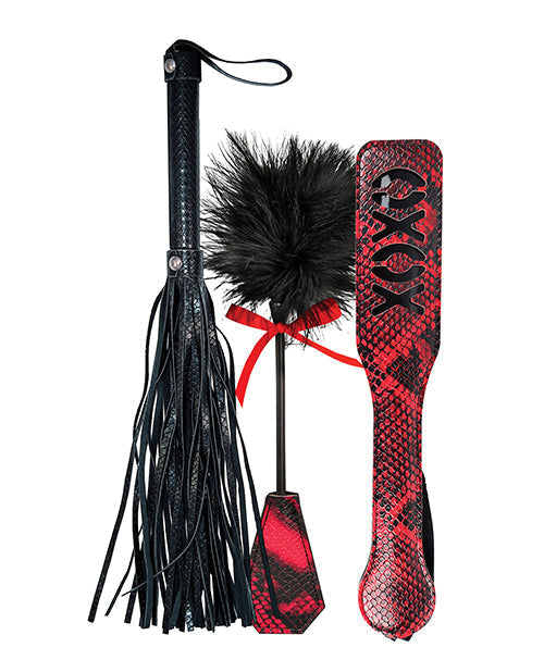 Black and red flogger with a black feathered attachment on a white background