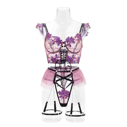 Lingerie set with floral design on a mannequin against a white background
