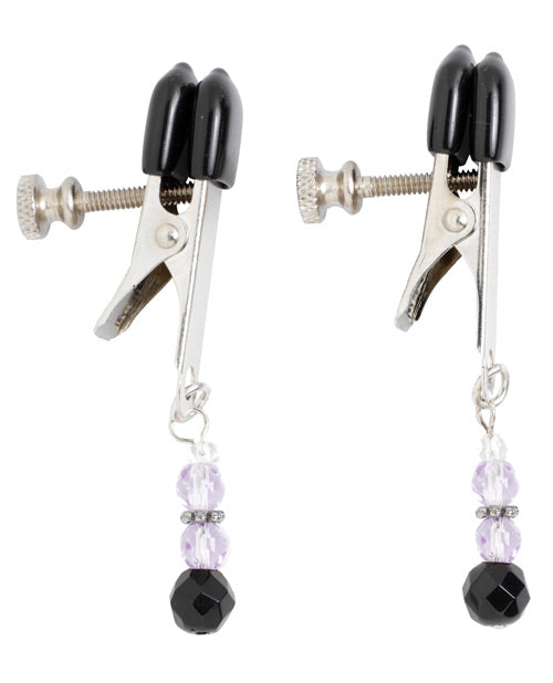 Pair of black and silver clamps with beaded charms on a white background