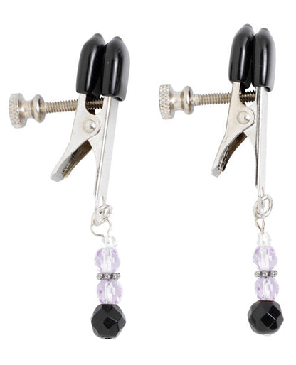Pair of black and silver clamps with beaded charms on a white background