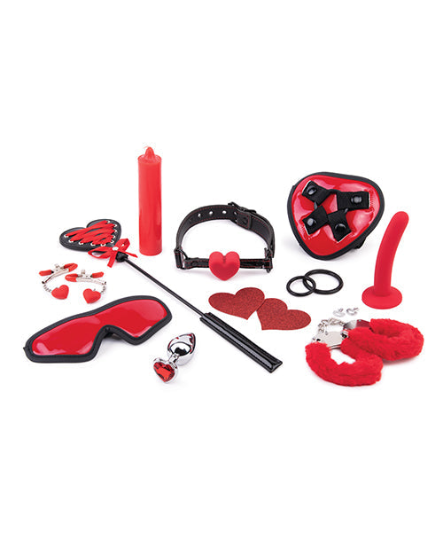 Collection of red and black bondage toys on a white background