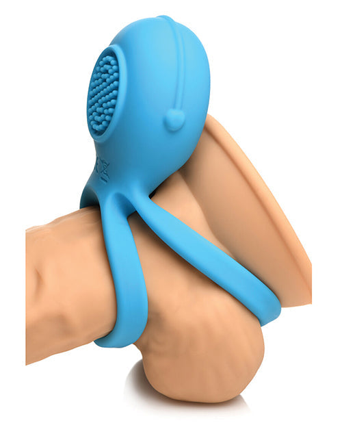 Blue silicone tool with textured head on a white background