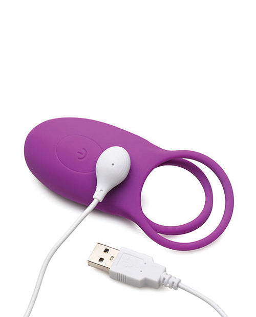 Purple electronic device with white USB cable on a white background