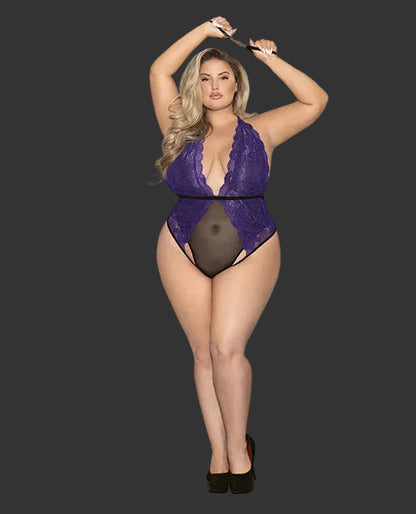 Woman wearing a purple lace lingerie set against a gray background