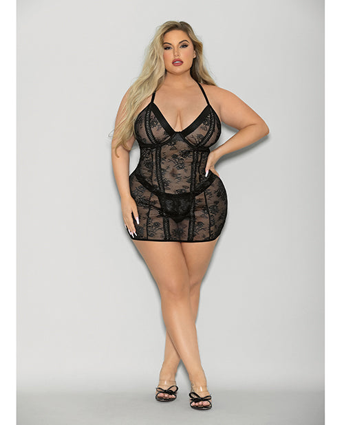 Woman wearing a black lace lingerie set on a gray background