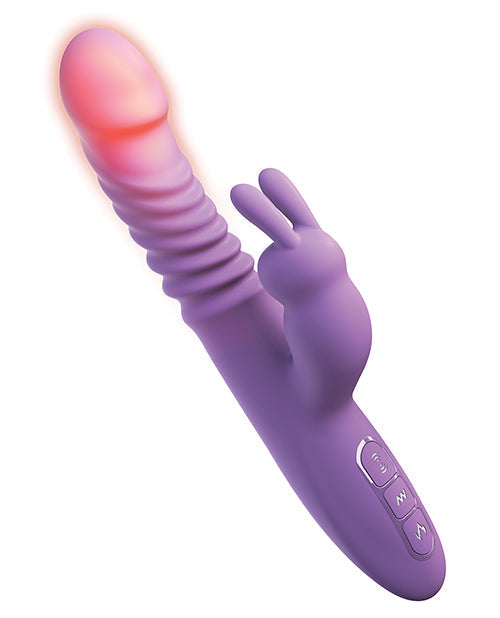 Purple toy with a glowing red tip on a white background