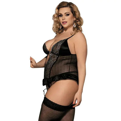 Woman wearing black lingerie and fishnet stockings on a white background