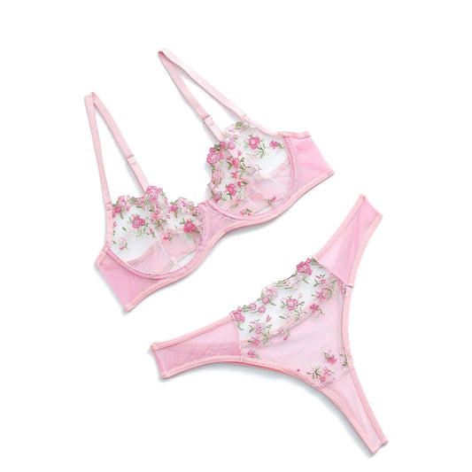 Pink floral lingerie set on a white background