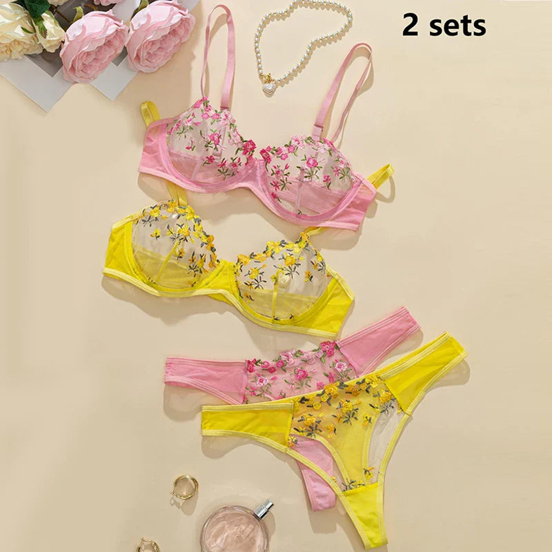 Floral lingerie set with pink and yellow colors on a beige background