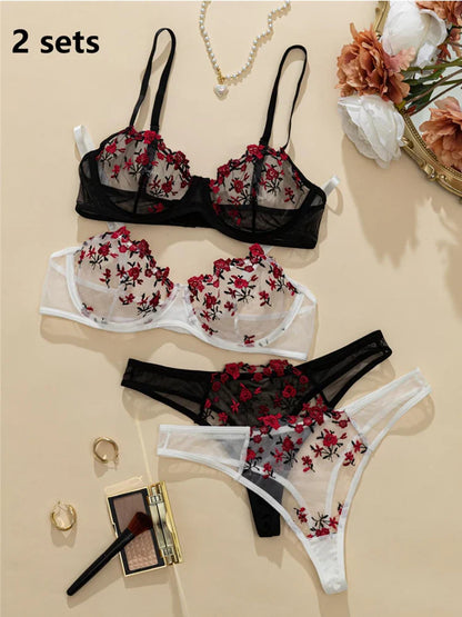 Floral embroidered lingerie set with accessories on a beige background